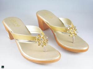 Heel type sandals for ladies in gold  with center stone in floral design